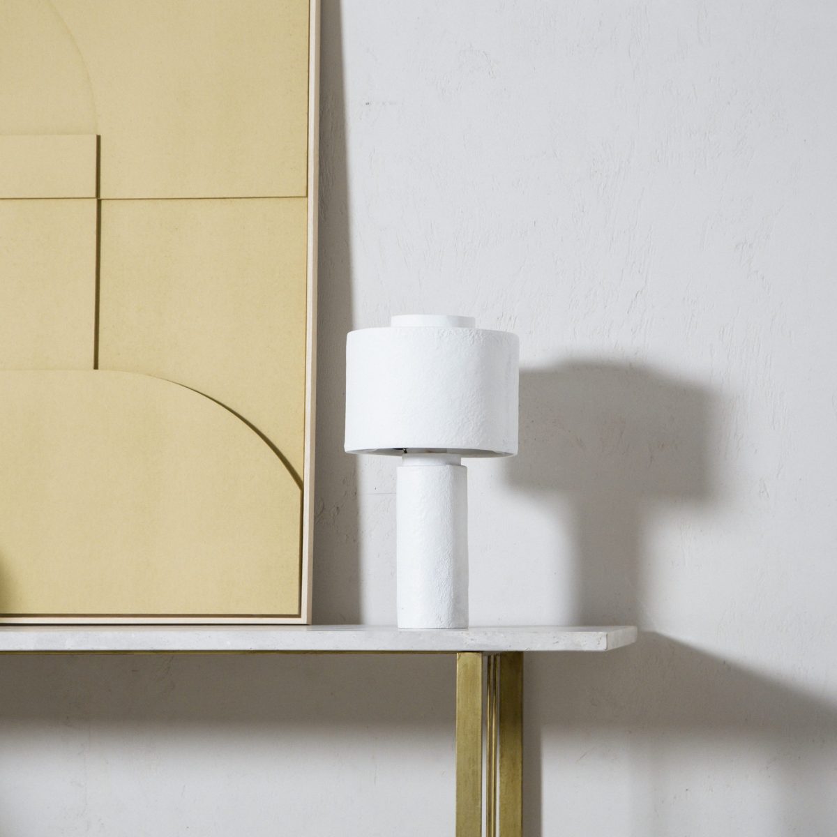 Lámpara de mesa de yeso en color blanco